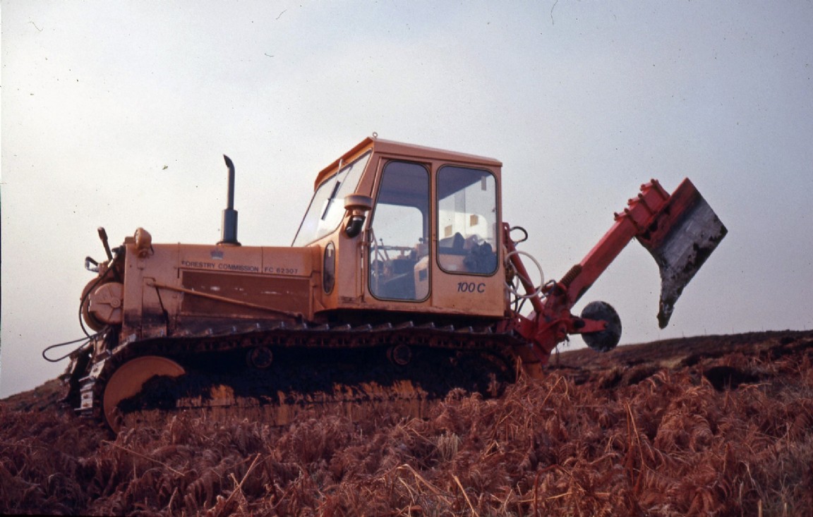 Ploughing tractor Fiat 100C with mounted tine 