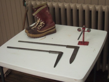 Boots, log calipers and chainsaw rivet driver.
