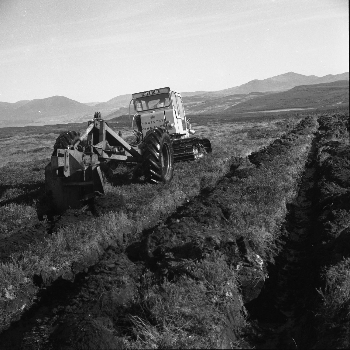 Ploughing tractor in unidentified Location