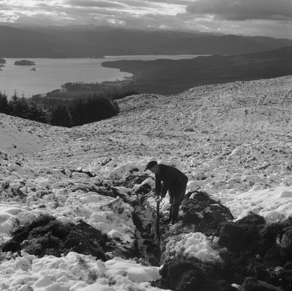 Deepening a forest drain by hand above Loch Avich