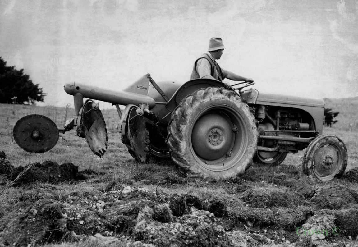 Grey Ferguson tractor and unidentified disc plough