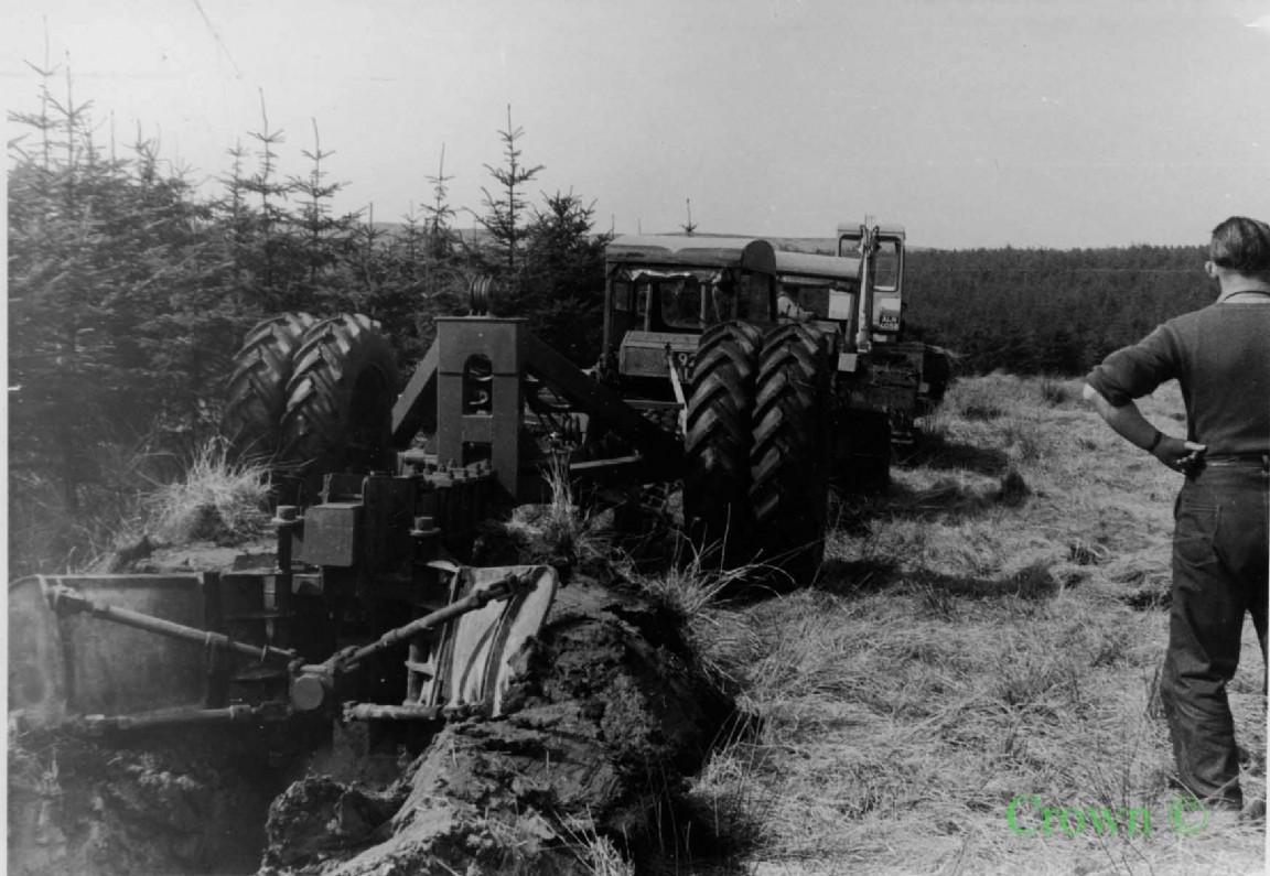 Three tractor pulling Double Mouldboard Plough