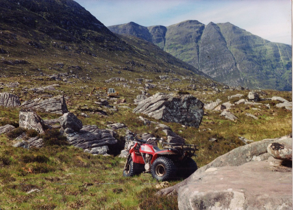 Mountaineering excavator near �The Fiddler� Achiltibuie