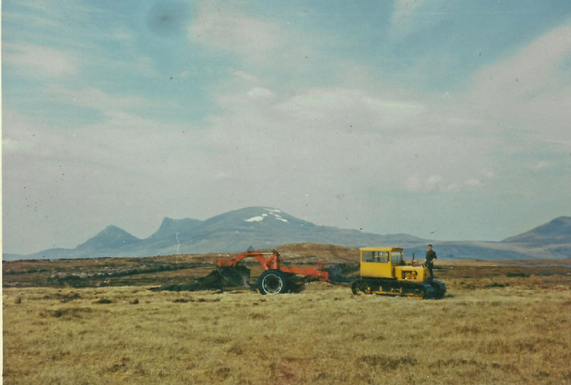 Cross draining team and equipment Loch Craggie, Benmore, Shin Forest