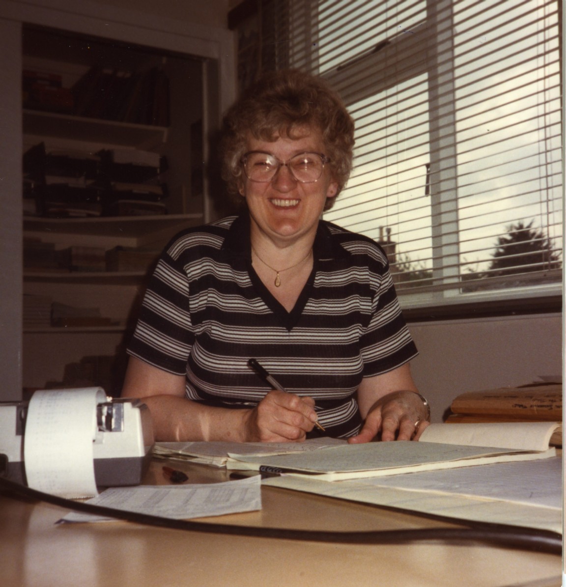 Myra Younie at payroll desk in Newton  Office, Moray Forest District