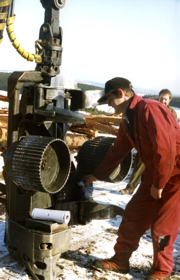 Roy Douglas servicing timber harvester